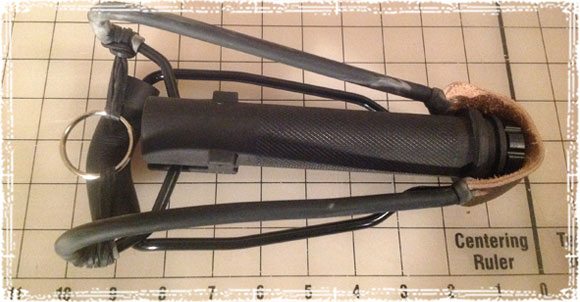 Front View of the slingshot on top of a measuring board