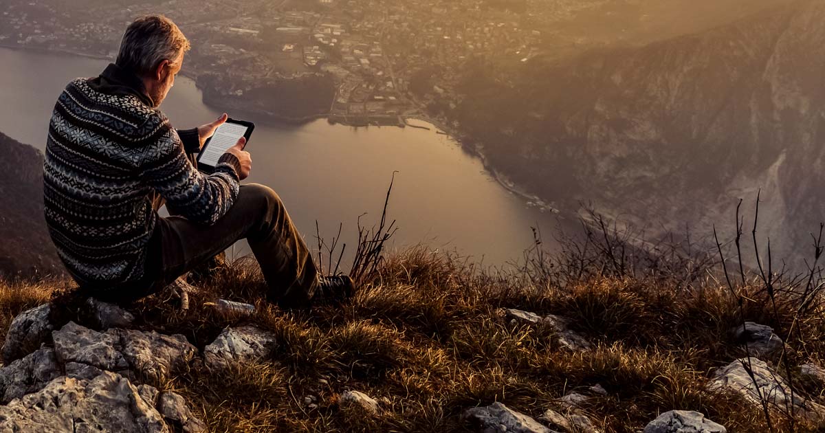 Guy reading a tablet