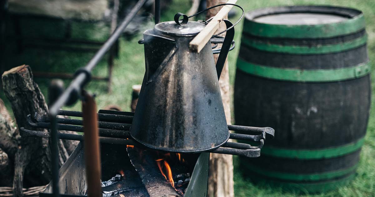 Boiling Water with Water Storage Barrel in the Background